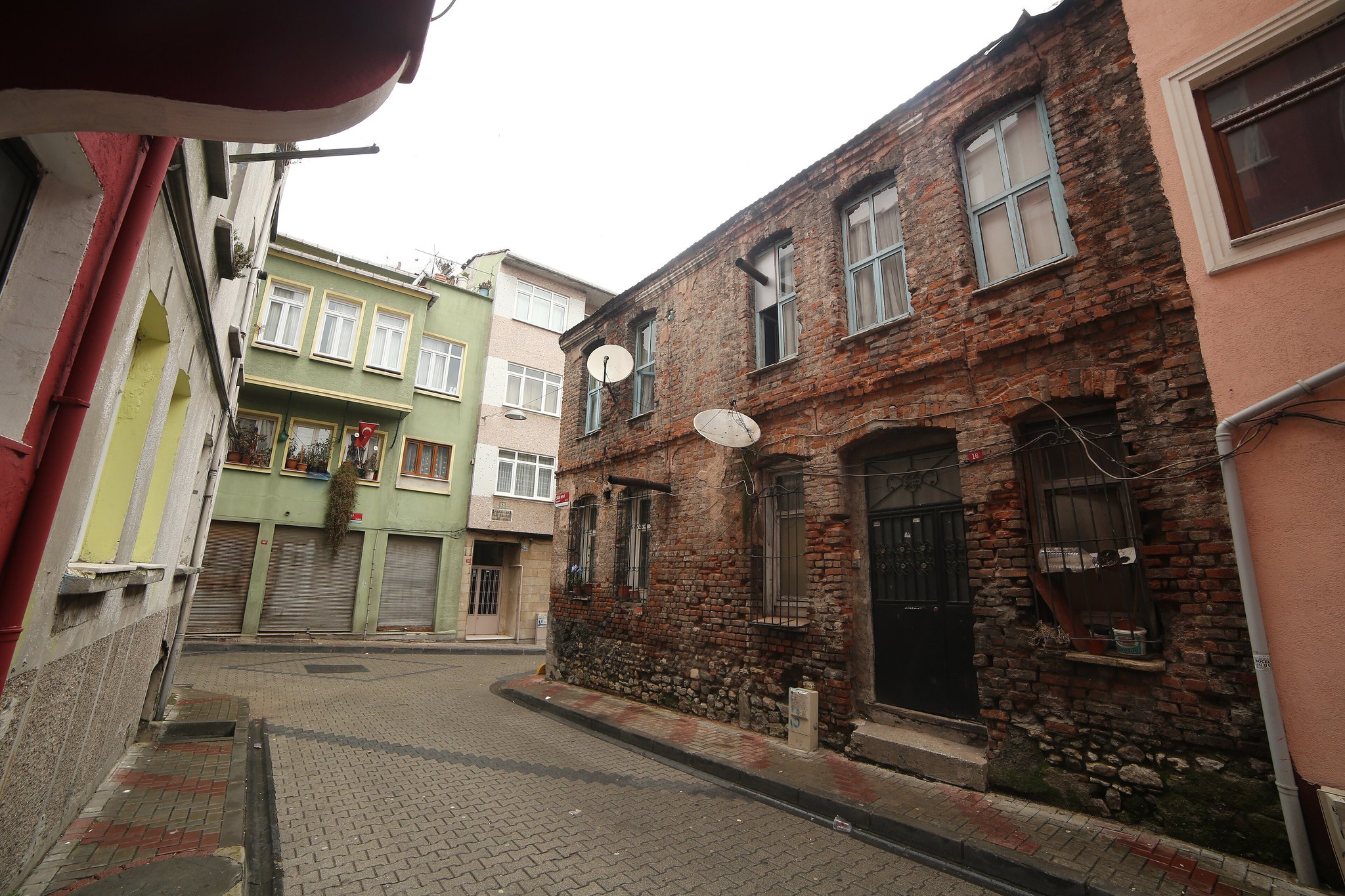 A wooden Balat house with its upper storey overhanging the narrow street