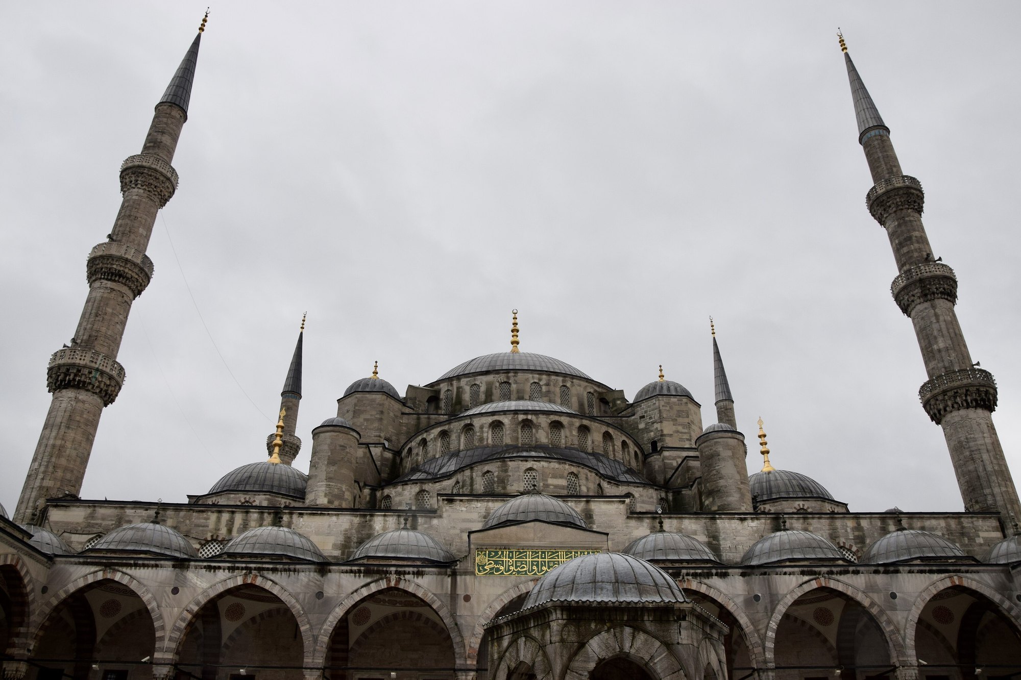 The Blue Mosque's outer courtyard and arcade seen from the entrance gate
