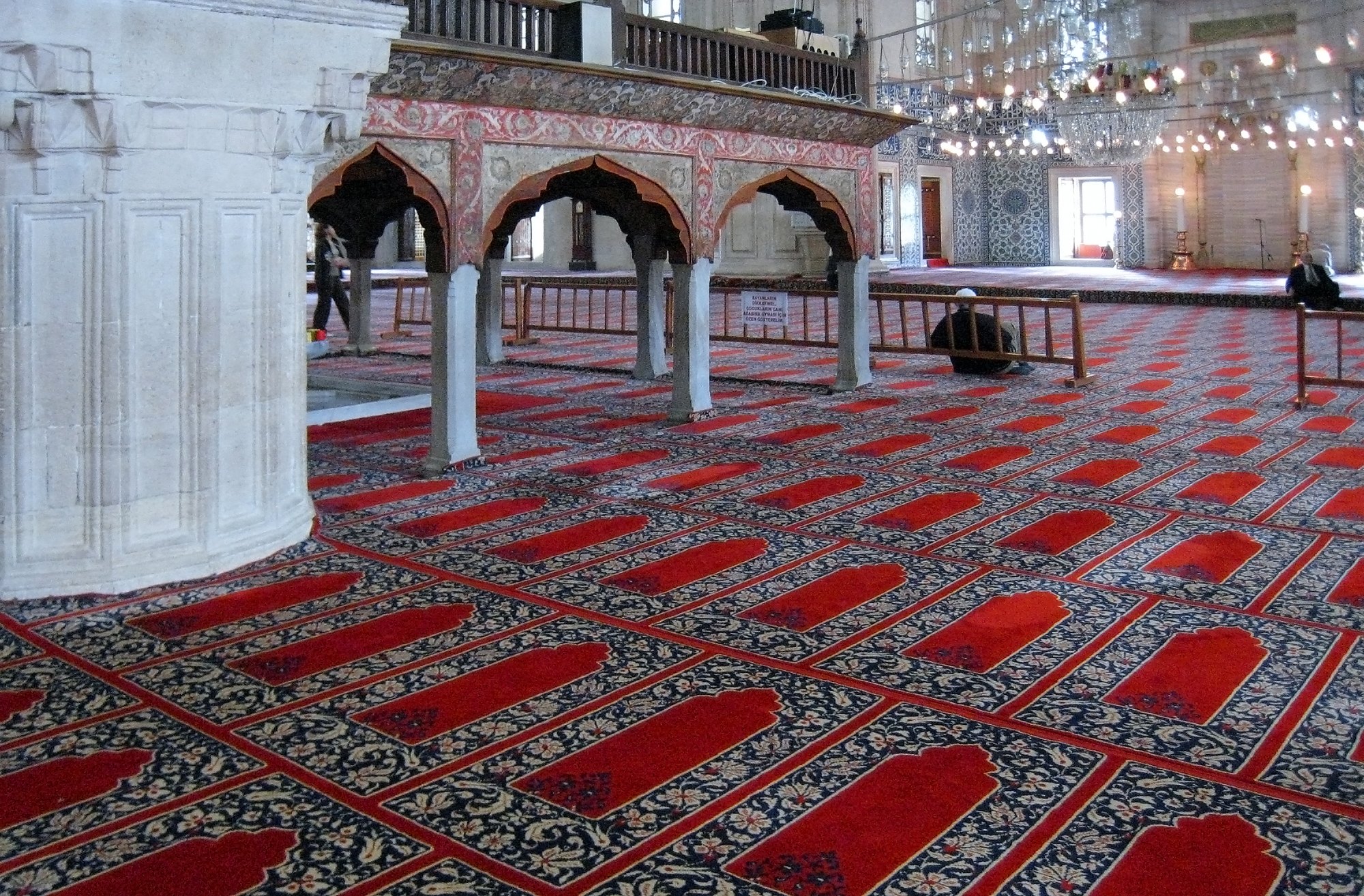 The prayer hall of the Selimiye Mosque at Edirne, red carpet running away between the piers