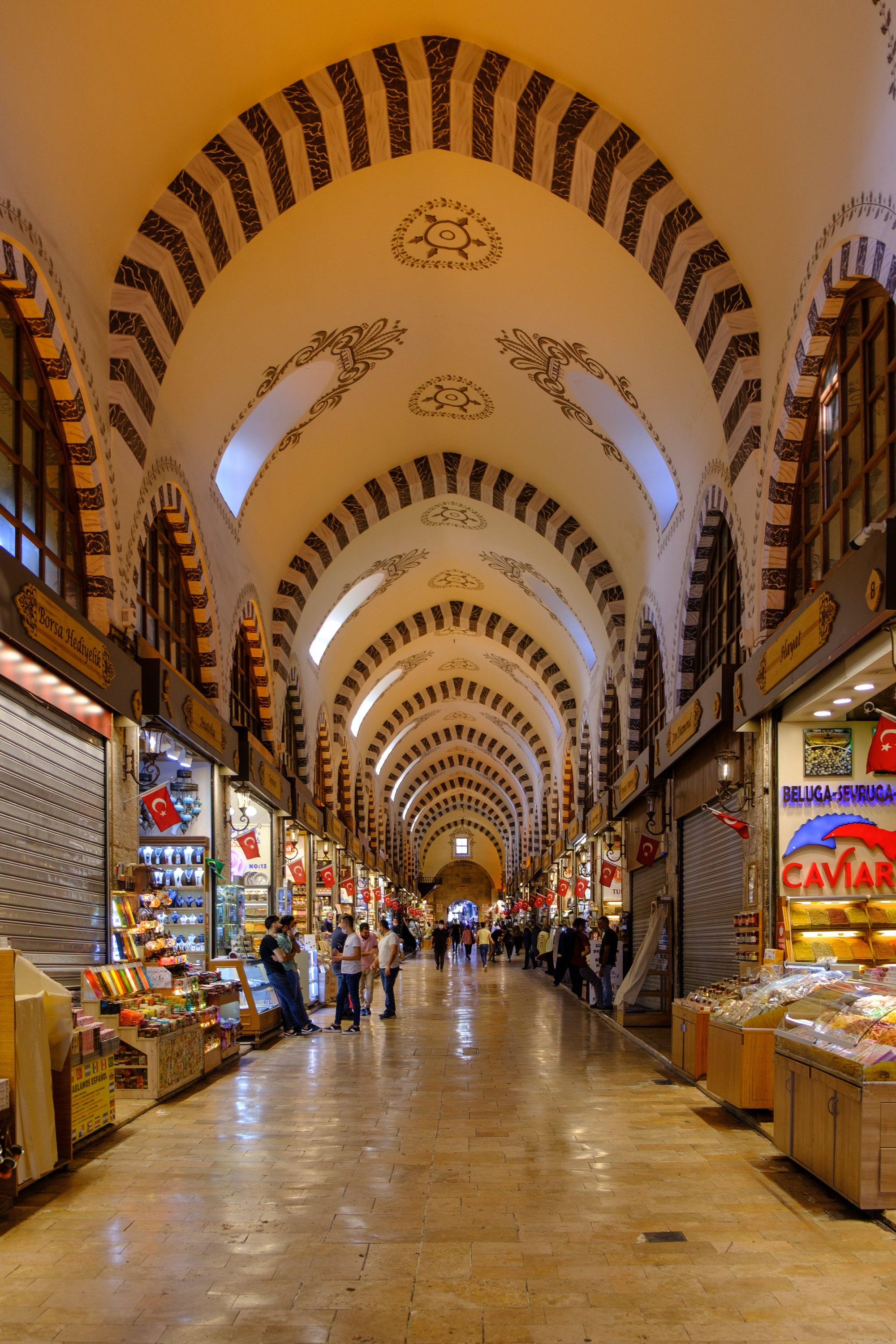 The interior of the Spice Bazaar, stalls under the pointed arches of its long hall