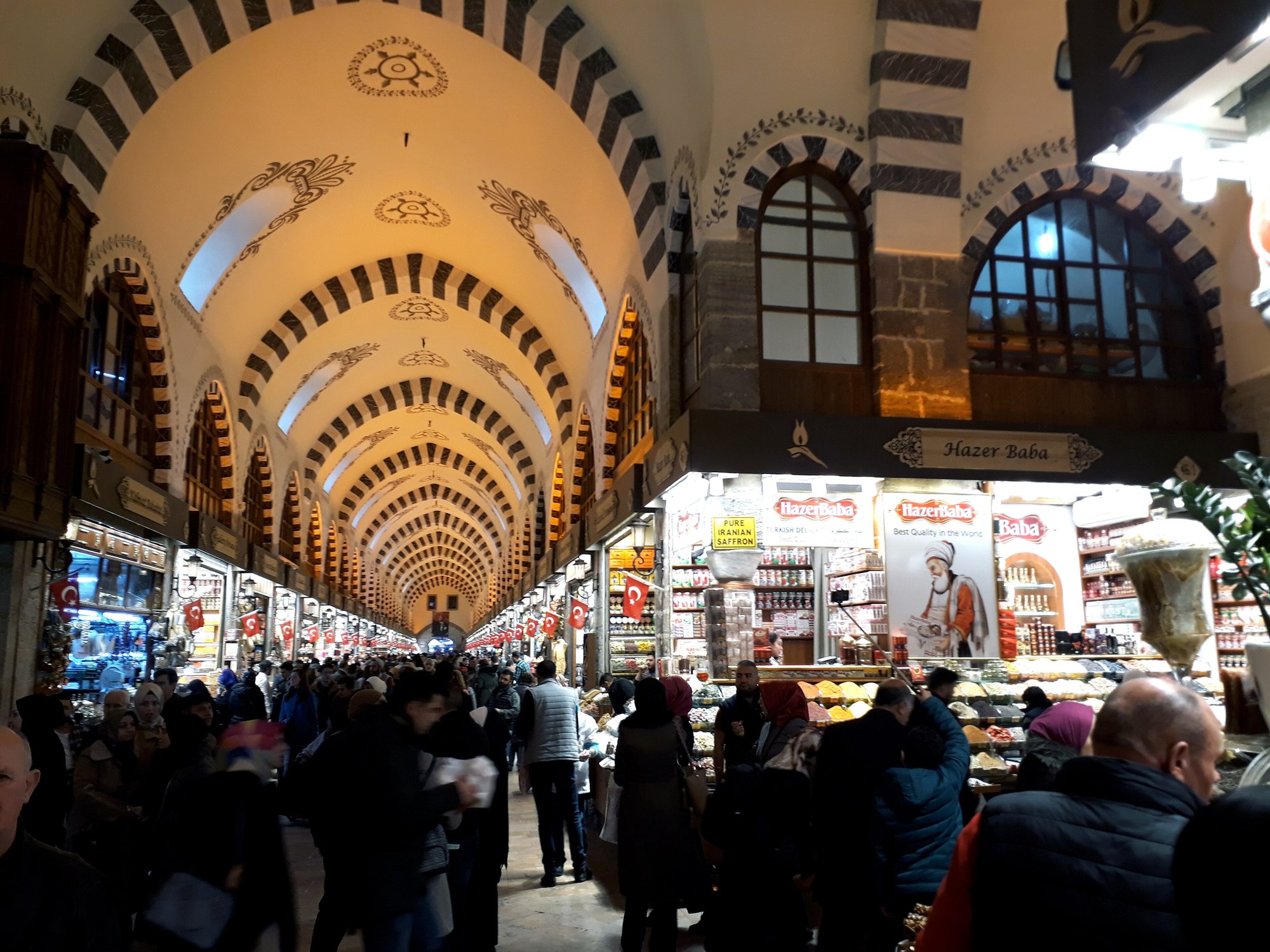 The Spice Bazaar hall from one end, shoppers under the arcaded ceiling