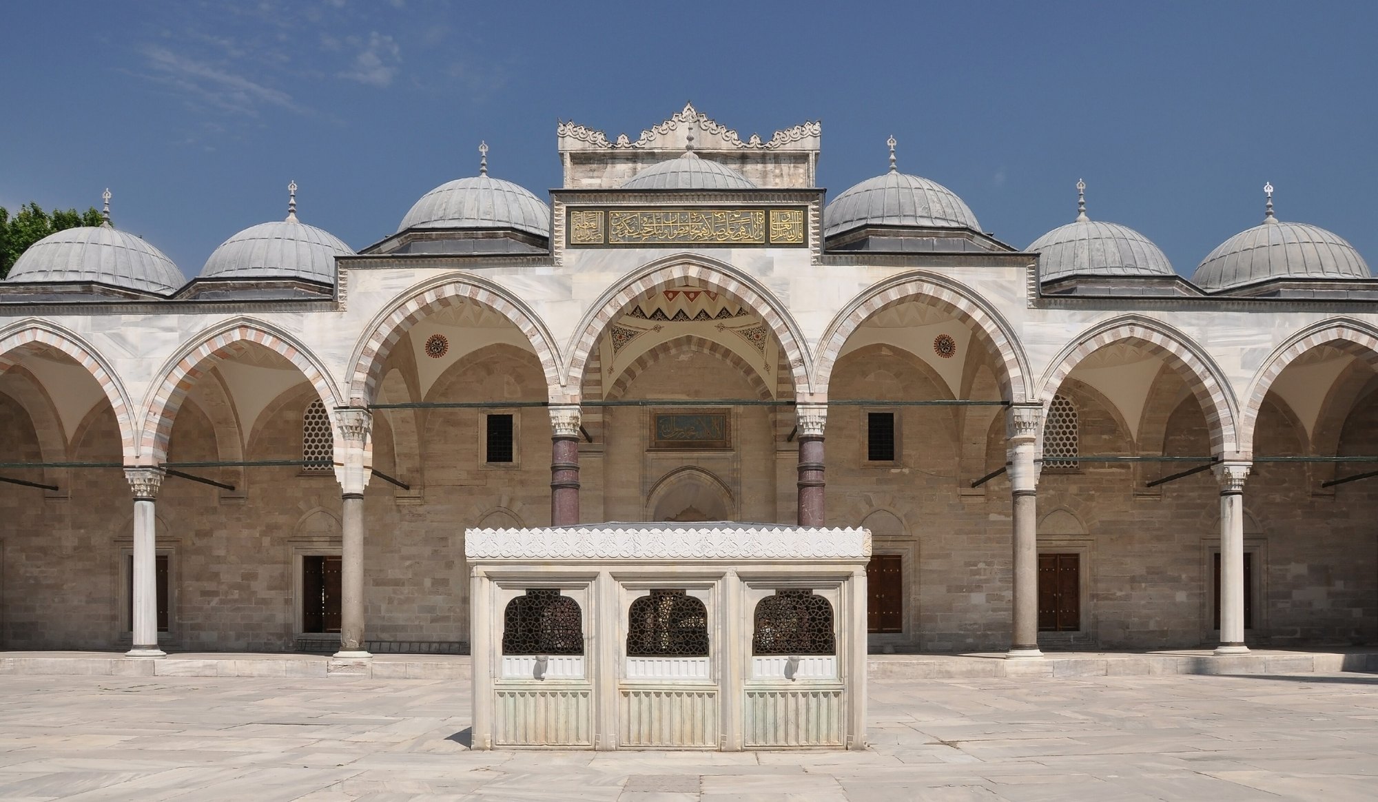 The courtyard of the Suleymaniye Mosque, its arcade of grey granite columns around the ablution fountain
