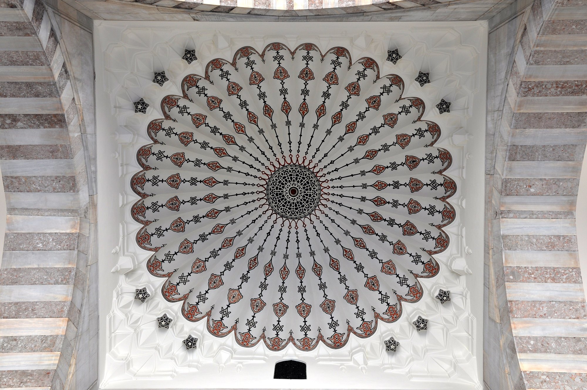 The dome of the Suleymaniye Mosque from directly below, its ribs radiating from a painted centre